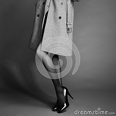 Young woman in coat with beautiful feet Stock Photo