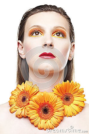 Young woman with colorful make-up and gerbera Stock Photo