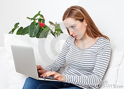 Young woman with concentration on a computer Stock Photo