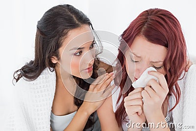 Young woman consoling a crying female friend Stock Photo
