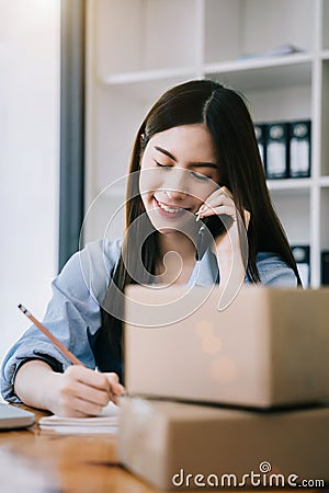 young women contacted a customer asking for a shipping address Stock Photo