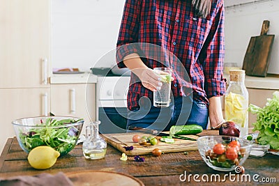 Young woman cooking healthy simple food home kitchen sunny evening Healthy food concept Stock Photo