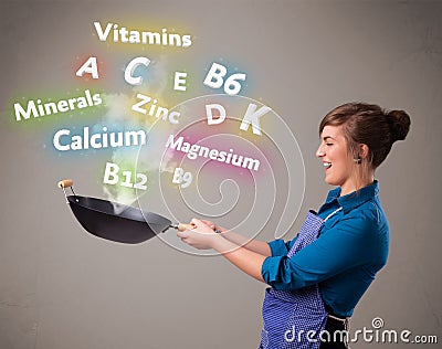 Young woman cooking vitamins and minerals Stock Photo