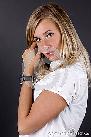 Young woman correcting hairs Stock Photo