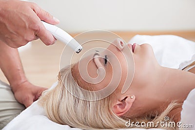 Young Woman During Cosmetic Treatment Stock Photo