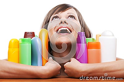 Young woman with cosmetics Stock Photo