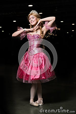 Young woman cosplayer wearing pink dress Stock Photo