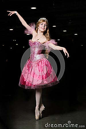 Young woman cosplayer wearing pink dress Stock Photo