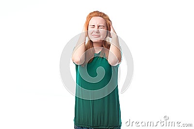 Young woman covers ears from loud sound Stock Photo