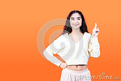 Young woman crosses her fingers for good luck. She wants the dream to come true. Stock Photo