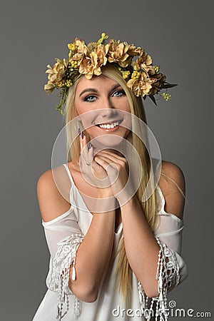 Young Woman With Crown of Flowers Stock Photo