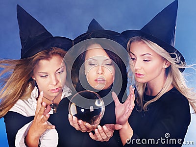 Young woman with crystal ball. Fortune Telling. Stock Photo