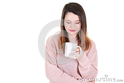 Young woman with cup of coffee looks down pensive thinking Stock Photo
