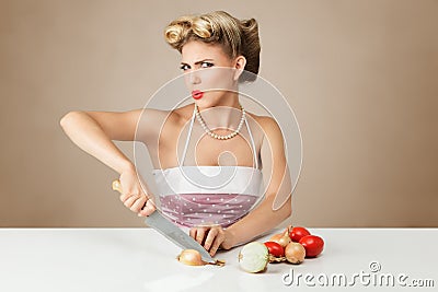 Young woman cutting onion Stock Photo
