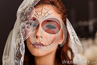 Young woman in day of the dead mask Stock Photo