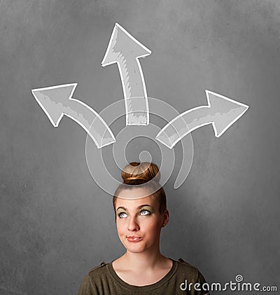 Young woman deciding with sketched arrows above her head Stock Photo