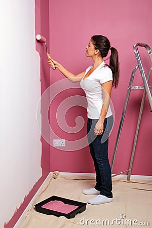 Young woman decorating Stock Photo