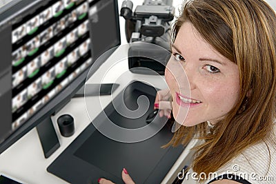 Young woman designer using graphics tablet Stock Photo