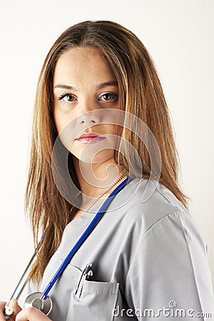 Young woman doctor or nurse wearing scrubs Stock Photo