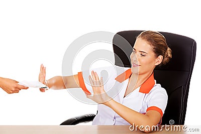 Young woman doctor refusing bribe Stock Photo