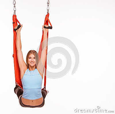 Young woman doing anti-gravity aerial yoga in Stock Photo