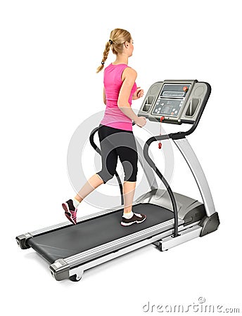 Young woman doing exercises on treadmill Stock Photo