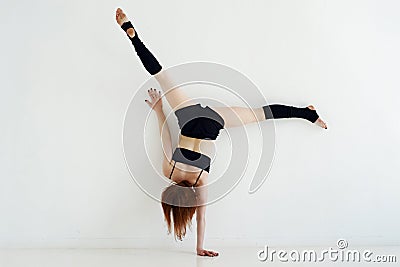 Young woman doing gymnastics or callisthenics Stock Photo