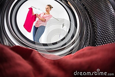 Young woman doing laundry Stock Photo