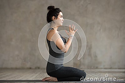 Young woman doing seiza exercise Stock Photo