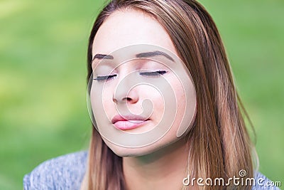 Young woman doing stretches outdoors Stock Photo