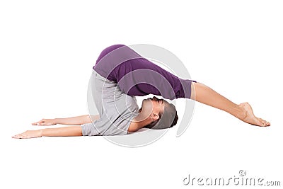 Young woman doing yoga exercise Halasana (Plow Pose). Isolated o Stock Photo