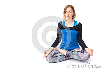 Young woman doing yoga practice isolated on white background. Concept of healthy life and natural balance between body and mental Stock Photo