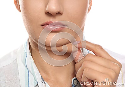 Young woman with double chin on white background Stock Photo