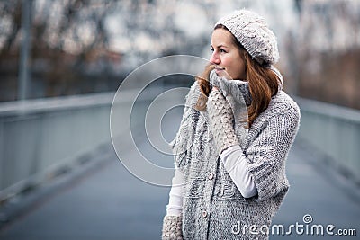 Young woman dressed in a warm woolen cardigan Stock Photo