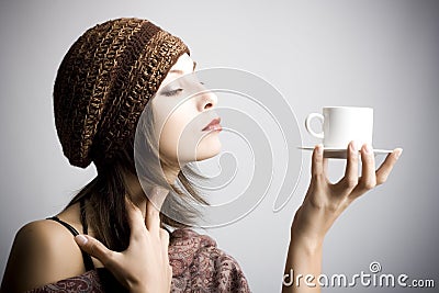 Young woman drinking coffee Stock Photo