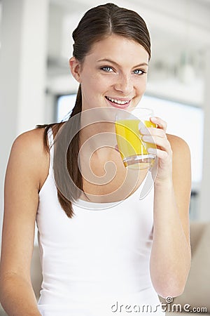 Young Woman Drinking A Glass Of Orange Juice Stock Photo