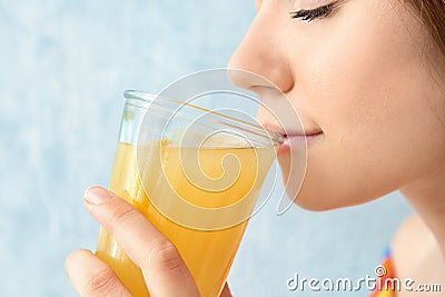 Young woman drinking lemon juice Stock Photo