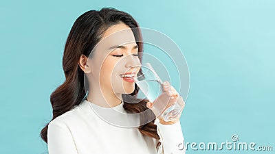 Young woman drinks clean water adheres to drinking regime Stock Photo