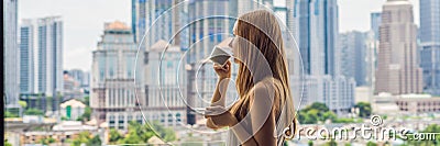 Young woman drinks coffee in the morning on the balcony overlooking the big city and skyscrapers BANNER long format Stock Photo