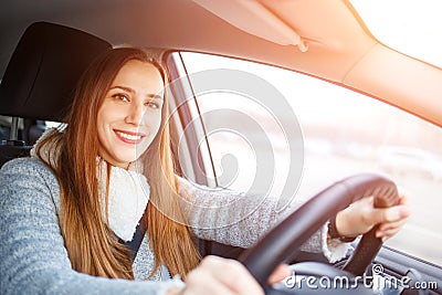 Young woman drive a car in winter Stock Photo