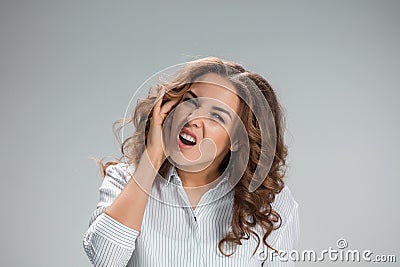 The young woman with earache over gray Stock Photo