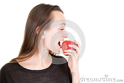 Young woman eating fresh red apple in closeup on copy space white background Stock Photo