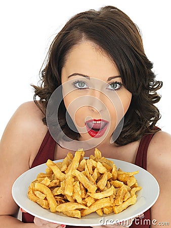 Young Woman Eating a Large Plate of Fried Chips Stock Photo