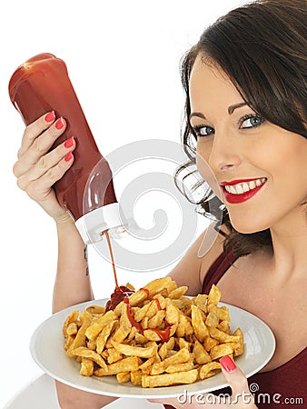 Young Woman Eating a Large Plate of Fried Chips Stock Photo