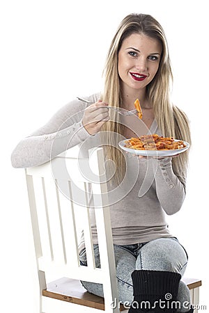 Young Woman Eating Penne Pasta Stock Photo