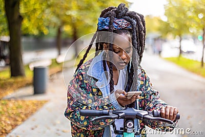 Activating electric scooter from smartphone Stock Photo