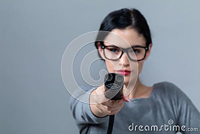Young woman with an electric vehicle charger Stock Photo