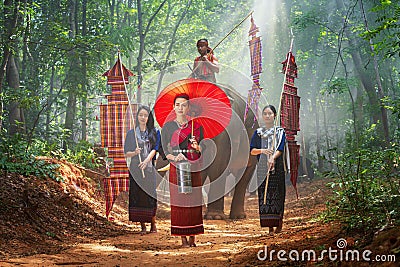 Young woman and Elephant mahout portrait. The Kuy Kui People of Thailand. Elephant Ritual Making or Wild Elephant Catching Stock Photo