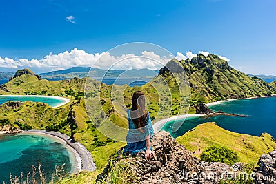Young woman enjoying the awesome view of Padar Island during sum Stock Photo