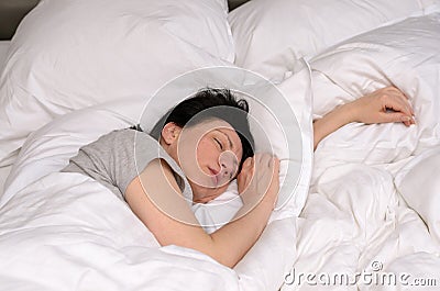 Young woman enjoying a good restful sleep Stock Photo